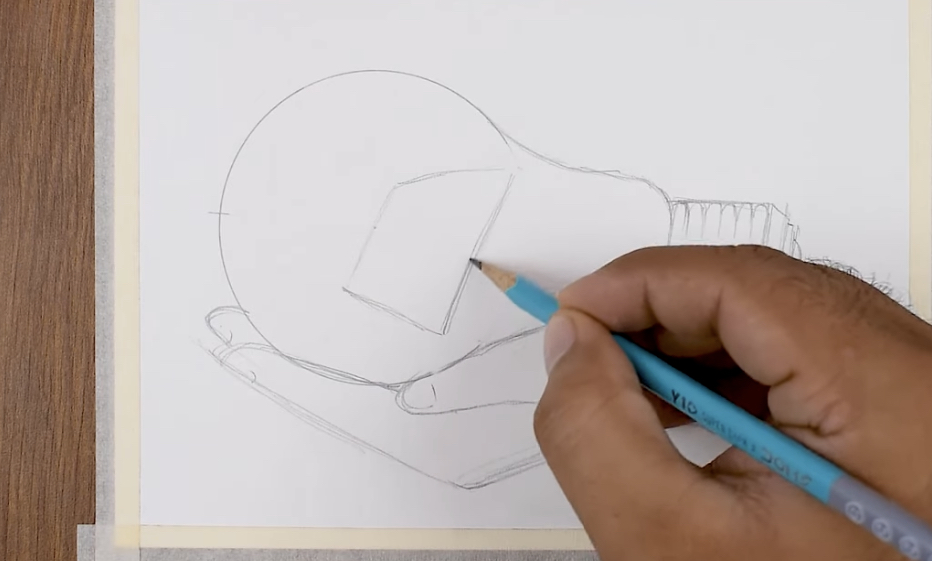 An artist's hand holding a pencil and sketching the basic geometric shapes