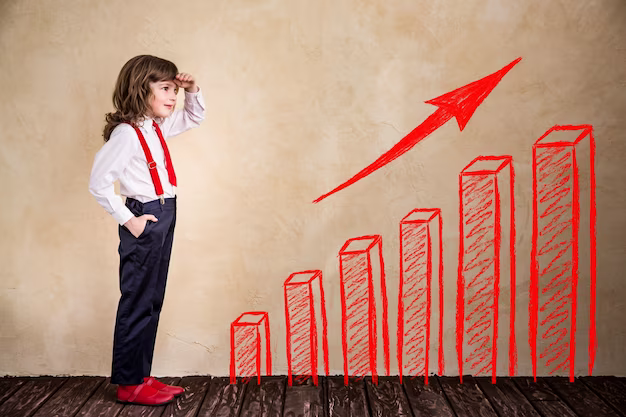 A boy stands next to a red graph