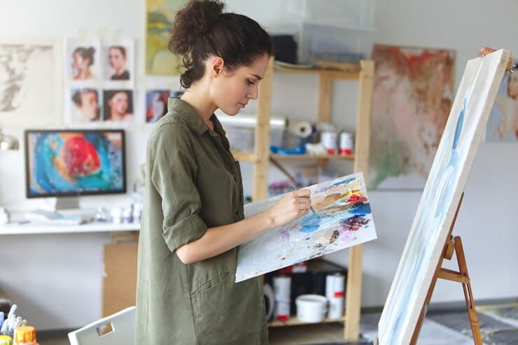 Woman is Painting in Art Studio