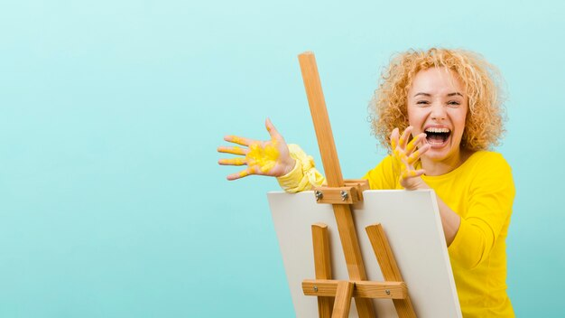 Happy Woman is Smiling and Painting